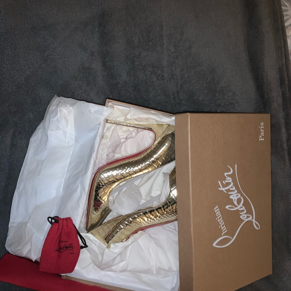 Gold pigalle christian louboutin heels.